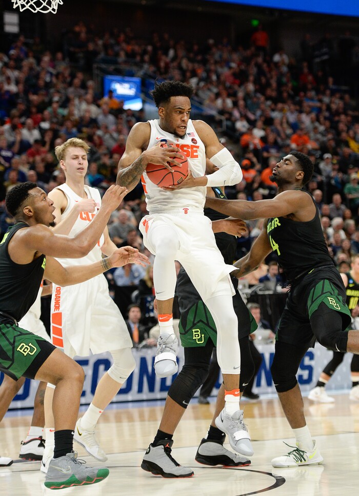 (Francisco Kjolseth  |  The Salt Lake Tribune)  Syracuse Orange forward Oshae Brissett (11) pulls down a ball as Syracuse faces Baylor in their first round menÕs NCAA March Madness tournament game at Vivint Smart Home Arena in Salt Lake City on Thursday, March 21, 2019.