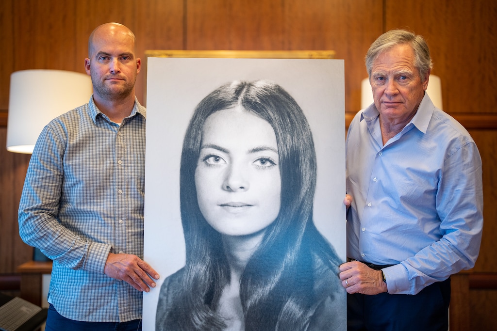 (Trent Nelson  |  The Salt Lake Tribune) Ryan and John Miller with a portrait of Valarie Clark Miller in Salt Lake City on Thursday, Dec. 1, 2022. Valarie is John's late wife, and Ryan's mother.
