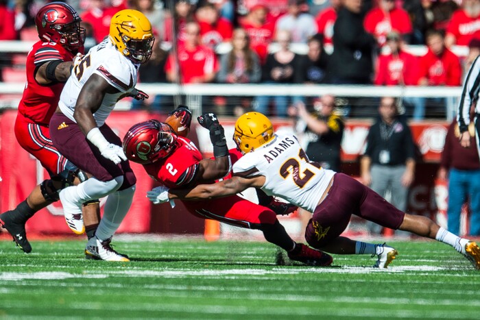 (Chris Detrick  |  The Salt Lake Tribune)  Utah Utes running back Zack Moss (2) is tackled by Arizona State Sun Devils defensive back Chad Adams (21) during the game at Rice-Eccles Stadium Saturday, October 21, 2017. 