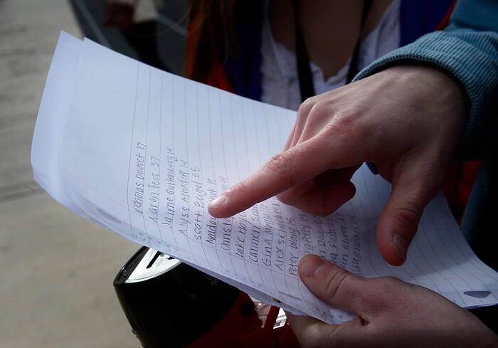 Scott Sommerdorf | The Salt Lake Tribune
Student organizer Isaac Reese reads through each of the 17 students and staff killed at Marjory Stoneman Douglas High School, during their walkout at Brighton High School, Wednesday, March 14, 2018.
