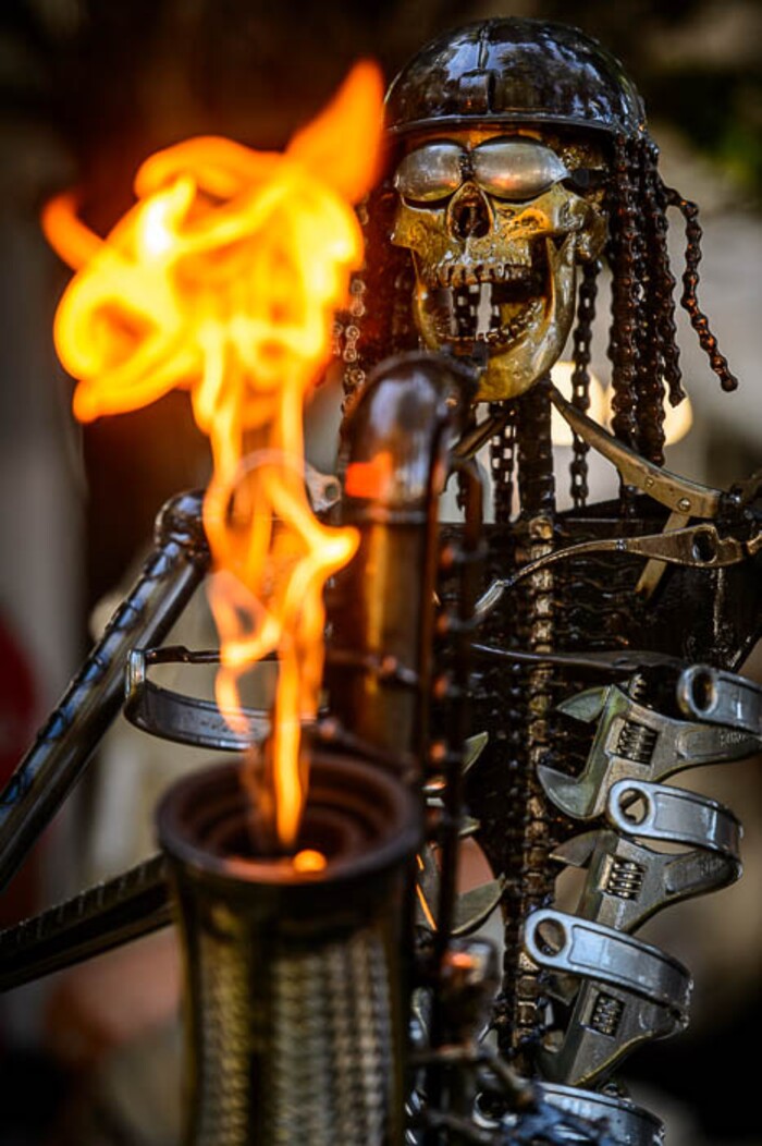 (Trent Nelson | The Salt Lake Tribune)A skeletal saxophone-playing sculpture by Fred Conlon gets flaming hot at the Utah Arts Festival in Salt Lake City, Thursday June 21, 2018.