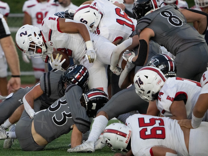 (Francisco Kjolseth | The Salt Lake Tribune)  Amini Amone (2) of East is taken down by the Park City Miners defense In prep football action between Park City on Friday, Sept. 3, 2021.