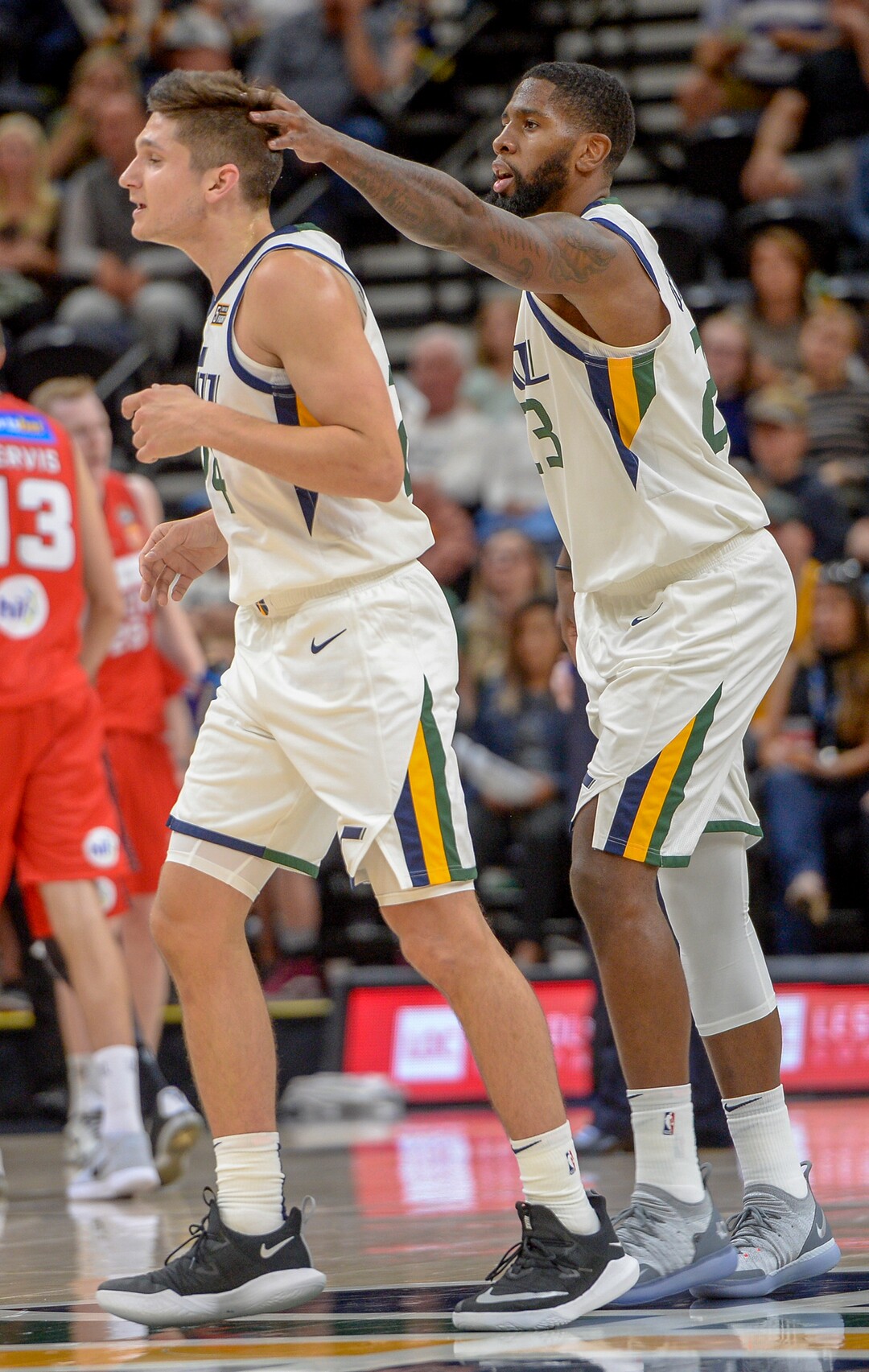 Leah Hogsten  |  The Salt Lake Tribune  Utah Jazz guard Grayson Allen (24) is congratulated on play by teammate Utah Jazz forward Royce O'Neale (23) as the Utah Jazz host the Perth Wildcats, Sept. 29, 2018 at Vivint Smart Home Arena.