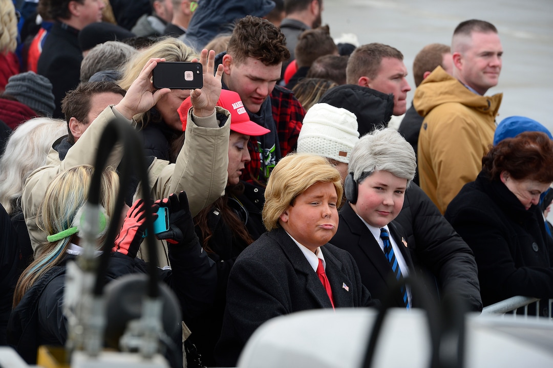 (Scott Sommerdorf   |  The Salt Lake Tribune)   Two young boys dressed as Trump waited for the arrival of Air Force One at the Ronald R Wright National Air Guard Base, Monday, December 4, 2017.  