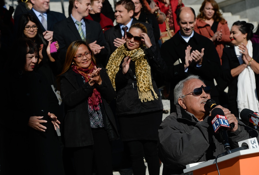 (Francisco Kjolseth  |  Tribune file photo) Archie Archuleta, a long time Latino activist in Salt Lake City, joins other Latino activists and families gathered on the South steps of the Utah Capitol on Friday, Nov. 21, 2014, for a news conference to talk about an immigration executive order from President Obama.