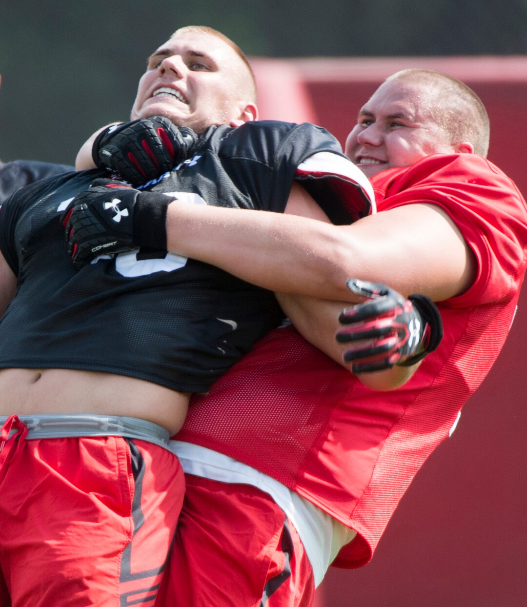 (Rick Egan  |  The Salt Lake Tribune)  Utah left tackle Jackson Barton (70) horses around with his brother, linebacker Cody Barton, during football practice, Monday, August 7, 2017.