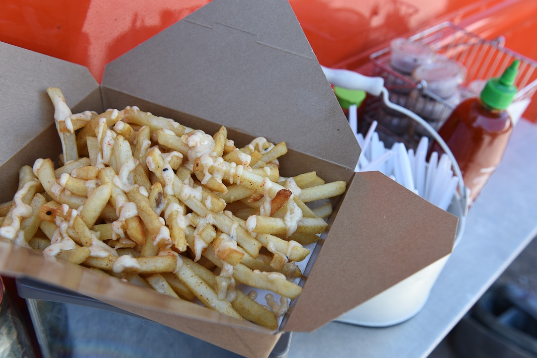 (Francisco Kjolseth  |  The Salt Lake Tribune)  The signature Tsunami fries at the Umai food truck are made with garlic, slightly spicy pepper blend and a drizzle of  "Asian fry sauce' made with citrusy yuzu.