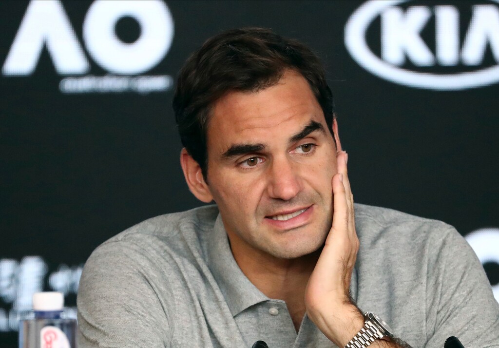 FILE - In this Jan. 30, 2020, file photo, Switzerland's Roger Federer speaks during a press conference following his semifinal loss to Serbia's Novak Djokovic at the Australian Open tennis championship in Melbourne, Australia. Federer leads the annual Forbes ranking of highest-paid athletes with what the magazine says is $106.3 million in total earnings. He is the first tennis player top the list since it was first compiled in 1990. (AP Photo/Dita Alangkara, File)