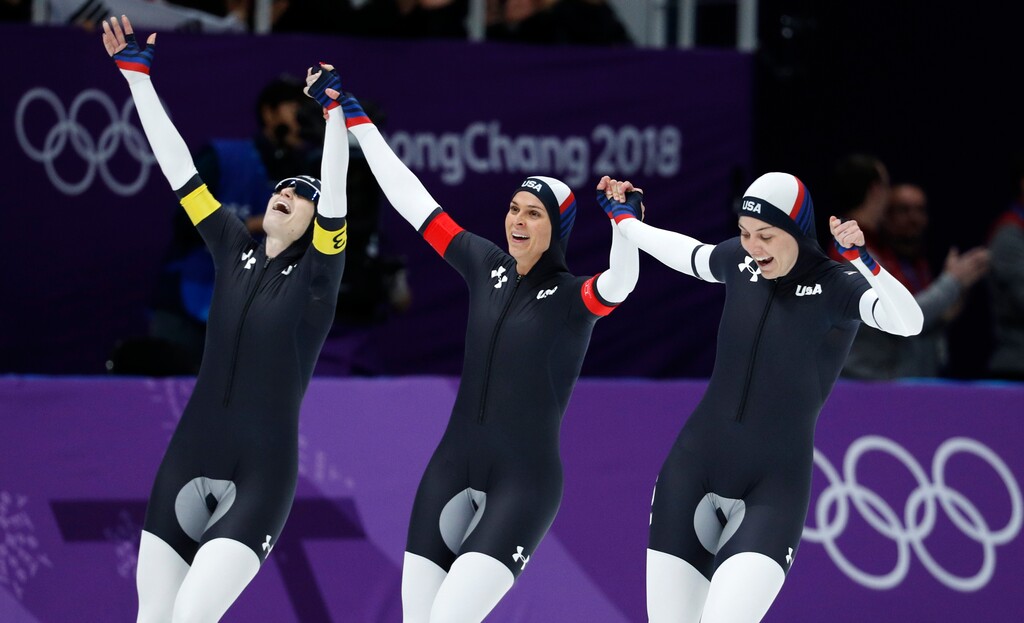 Team USA with Heather Bergsma, right, Brittany Bowe, center, and Mia Manganello, left, celebrates winning a bronze medal in the women's team pursuit final speedskating race at the Gangneung Oval at the 2018 Winter Olympics in Gangneung, South Korea, Wednesday, Feb. 21, 2018. (AP Photo/John Locher)