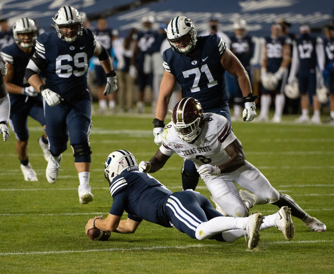 (Francisco Kjolseth  |  The Salt Lake Tribune) Brigham Young Cougars quarterback Zach Wilson (1) fumbles a snap recovered by Texas State near the end zone before the defensive lineup was able to stop any attempts at a touchdown by Texas State during an NCAA college football game at LavVell Edwards Stadium, Saturday, oct. 24, 2020, in Provo, Utah.