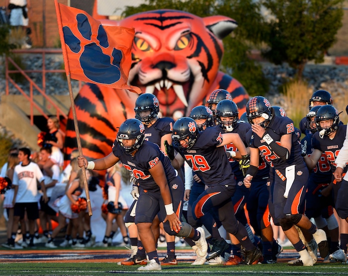 (Scott Sommerdorf   |  The Salt Lake Tribune)   
Brighton players take the field prior to the home matchup against Skyline. Skyline held a 14-10 lead at the half over Brighton, Friday, September 15, 2017.