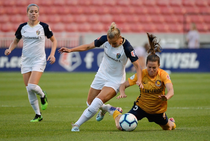 (Francisco Kjolseth  |  The Salt Lake Tribune)  North Carolina Courage defender Merritt Mathias (11) battles Utah Royals FC defender Kelley O'Hara (5) for possession as Utah Royals FC hosts the North Carolina Courage at Rio Tinto Stadium in Sandy, Utah on Saturday, July 27, 2019.