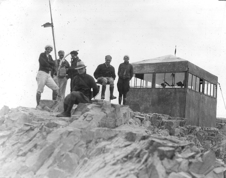 (Marriott Library, University of Utah) Members of the Wasatch Mountain Club hang out at the small shelter, known as the "Tin Shack," at the top of Mount Timpanogos in August 1931.