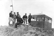 (Marriott Library, University of Utah) Members of the Wasatch Mountain Club hang out at the small shelter, known as the "Tin Shack," at the top of Mount Timpanogos in August 1931.