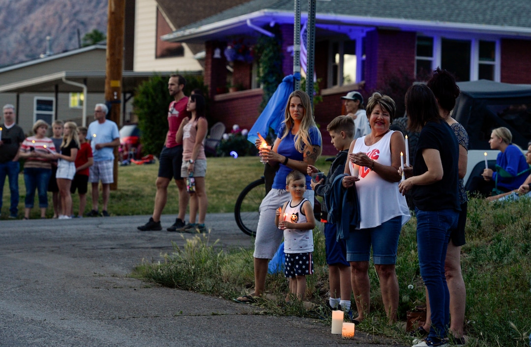 (Leah Hogsten  |  The Salt Lake Tribune) Friends and supporters lined the neighborhood of Officer Nate Lyday's childhood home on Custer Avenue in Ogden prior to the Memorial Procession and Community Vigil in honor of Lyday's life. The procession made its way through five other Ogden landmarks before ending at Lindquist Field.