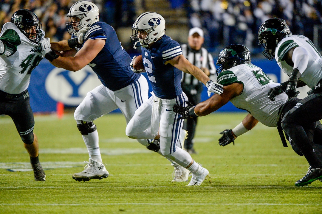 Leah Hogsten  |  The Salt Lake Tribune  Brigham Young Cougars running back Matt Hadley (2) slips past the Warrior defense on his touchdown run 33as Brigham Young University hosts Hawaii at Lavell Edwards Stadium in Provo, Saturday Oct. 13, 2018. 