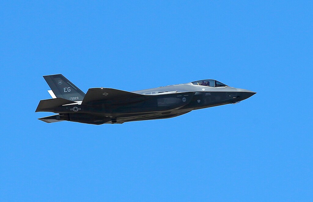 FILE - In this March 14, 2014 file photo, a U.S. Air Force F-35A Lightning II makes a flyby after an unveiling celebration takes place at Luke Air Force Base for the delivery of the first F-35A fighter jet, in Glendale, Ariz. (AP Photo/Ross D. Franklin, File)