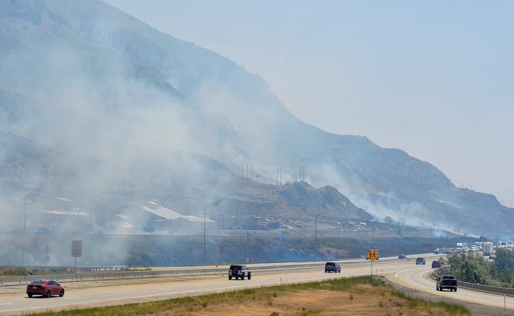 (Chris Samuels | The Salt Lake Tribune) Fire crews respond to a wildfire along Interstate 80 west of Magna, Friday, June 17, 2022.