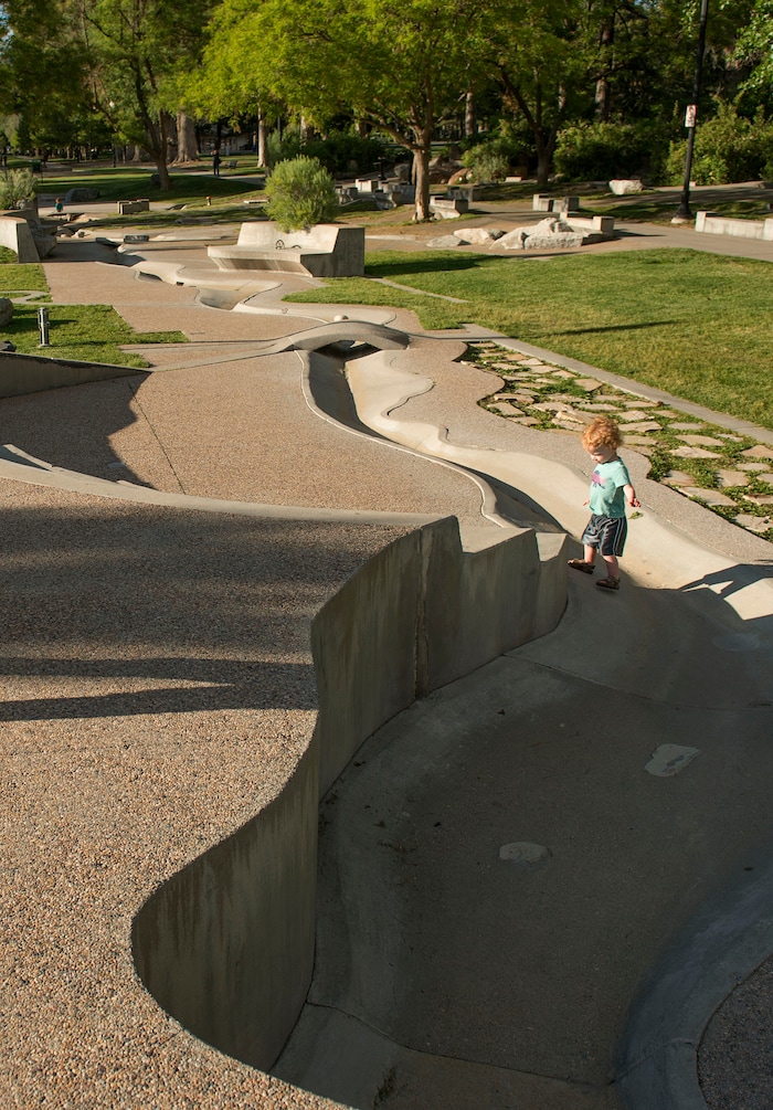 Leah Hogsten  |  The Salt Lake Tribune
Xander Nelson plays in the dry Seven Canyons fountain, Friday, May 26, 2017.
Liberty Park's Seven Canyons fountain will not be operational for 2017.  