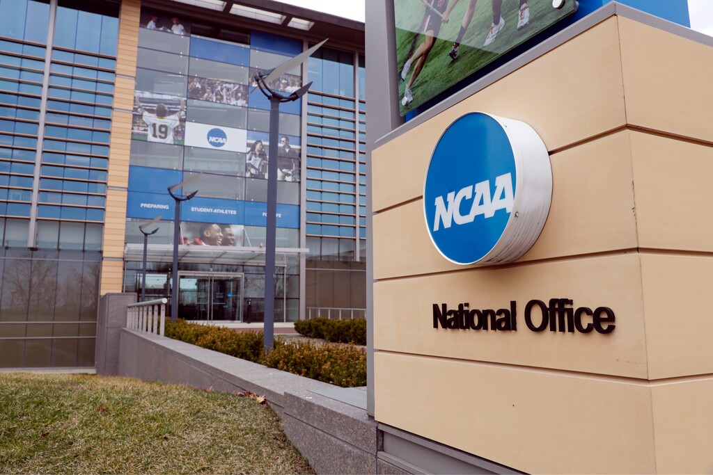 FILE - In this March 12, 2020, file photo, the national office of the NCAA in Indianapolis is shown. A set of proposals to permit NCAA athletes to earn money from endorsements and sponsorships deals will go up for vote in January, the last step for the association to change its rules but not the last word on how name, image and likeness compensation will work. (AP Photo/Michael Conroy, File)