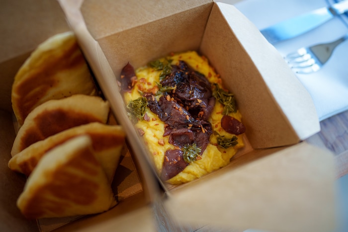 (Trent Nelson  |  The Salt Lake Tribune) Fava
(yellow split purée, roasted cipollini onions, grape leaf salsa verde, crunchy garlic,
pita bread) at Manoli's in Salt Lake City on Saturday, Jan. 8, 2022.