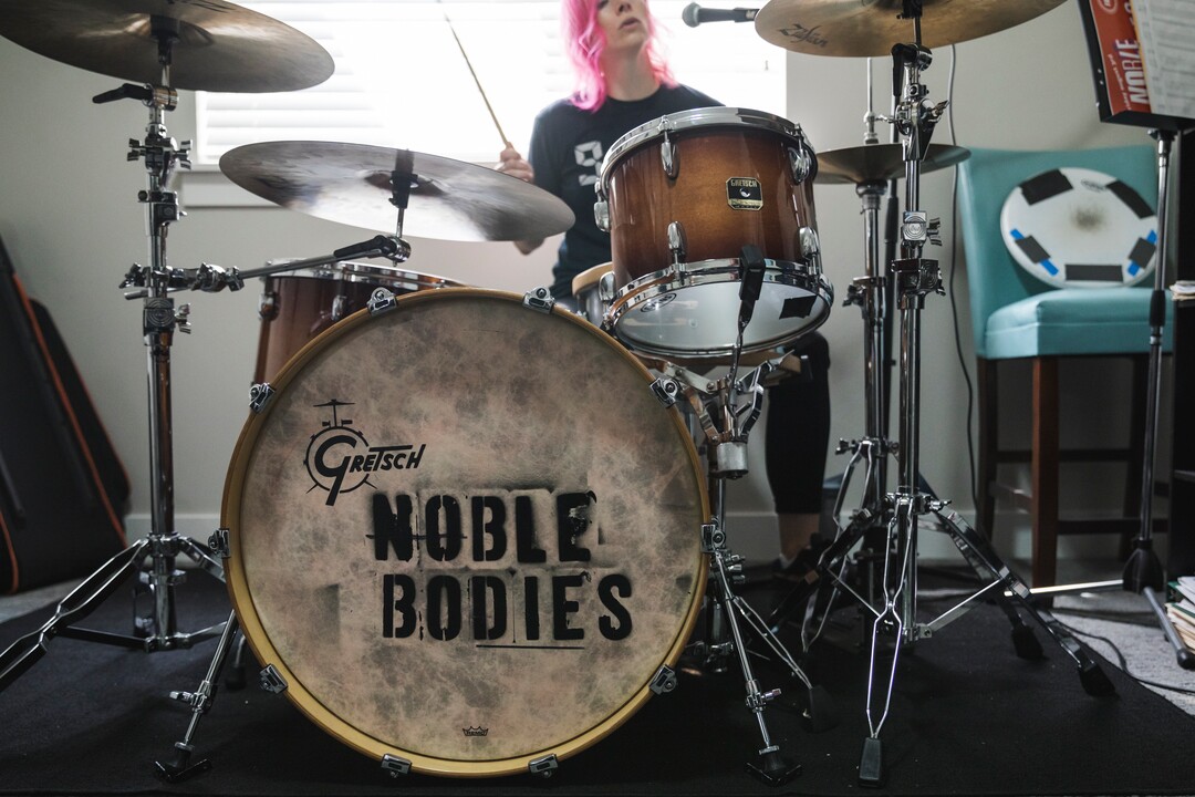 (Clark Clifford  |  For The Salt Lake Tribune) Elaine Bradley of Noble Bodies drumming during a practice for an upcoming show in the band's rehearsal space in Orem on Saturday, Aug. 3, 2019.