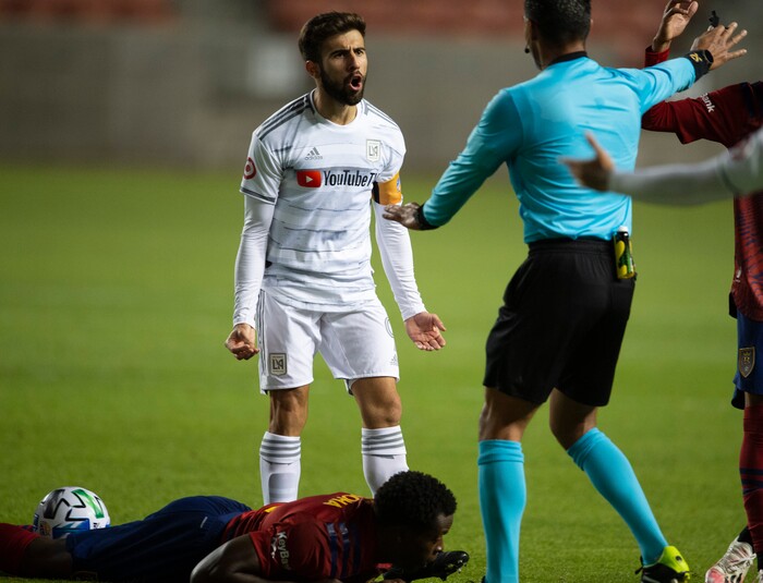 (Rick Egan  |  The Salt Lake Tribune). Real Salt Lake defender Nedum Onuoha (14) lies on the ground as Los Angeles FC forward Diego Rossi (9) complains to the official, in MLS soccer action between Real Salt Lake and Los Angeles FC at Rio Tinto Stadium, on Wednesday, Sept. 9, 2020.


