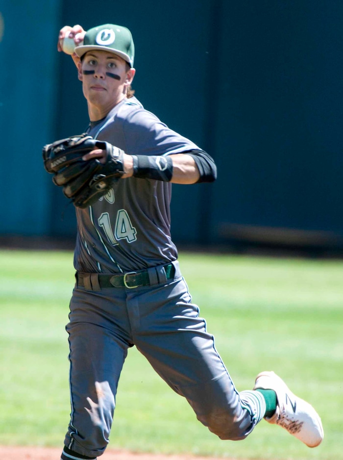 (Rick Egan  |  The Salt Lake Tribune)   Olympus short stop, Gabe Singer,  throws to first for an out, in the 5A state baseball championship game between Olympus and Jordan, at UVU in Orem, Friday, May 25, 2018.