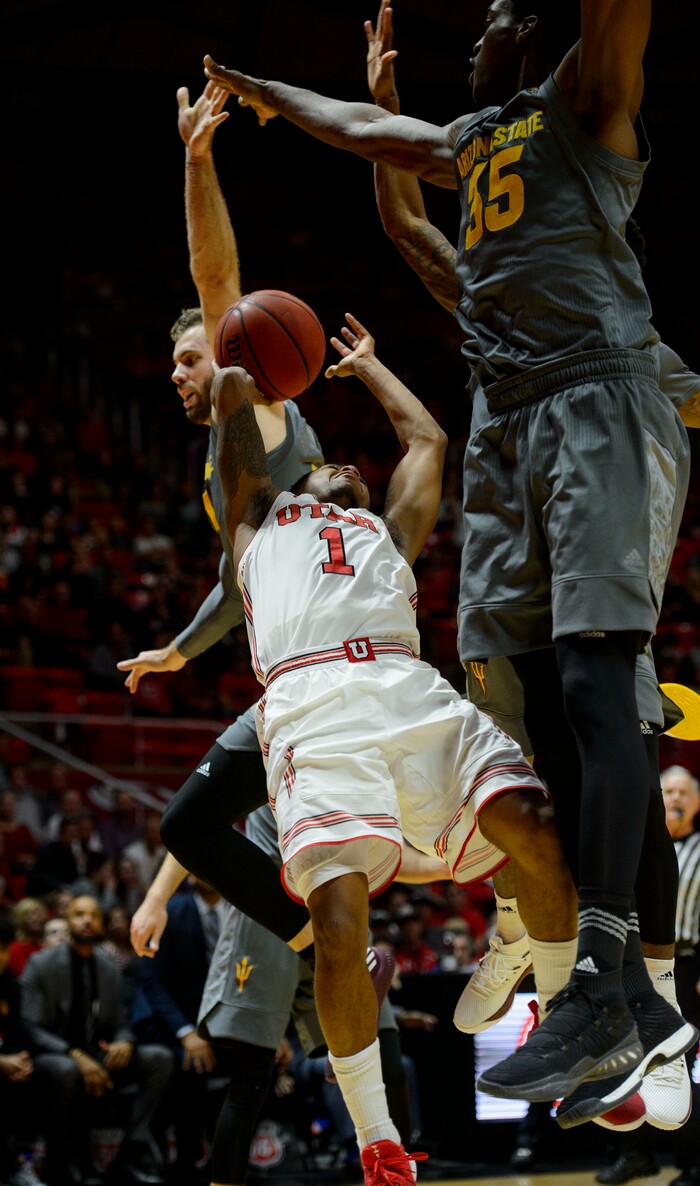 (Steve Griffin  |  The Salt Lake Tribune) Utah Utes guard Justin Bibbins (1) gets stopped at the rim by Arizona State Sun Devils forward De'Quon Lake (35) during the Utah Utes versus Arizona State Sun Devils at the Huntsman Center on the University of Utah campus in Salt Lake City Sunday January 7, 2018.