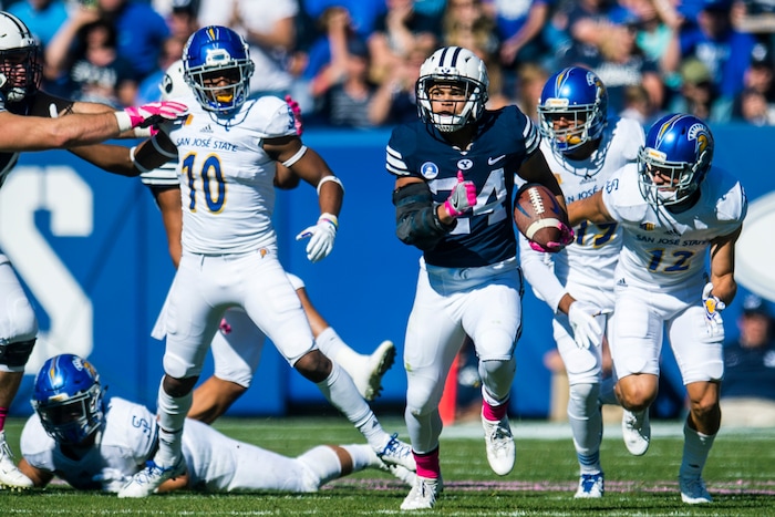 (Chris Detrick  |  The Salt Lake Tribune)  Brigham Young Cougars running back KJ Hall (24) scores a 75-yard touchdown past San Jose State Spartans safety Maurice McKnight (10) and San Jose State Spartans cornerback Brandon Ezell (12) during the game at LaVell Edwards Stadium Saturday, October 28, 2017.  