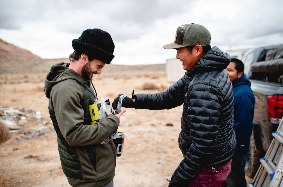 (Courtesy of Laura Dearden | Real Salt Lake Foundation) Real Salt Lake captain Kyle Beckerman (left) and photographer Mylo Fowler get ready to install a solar set-up at a home in San Juan County in November 2019.