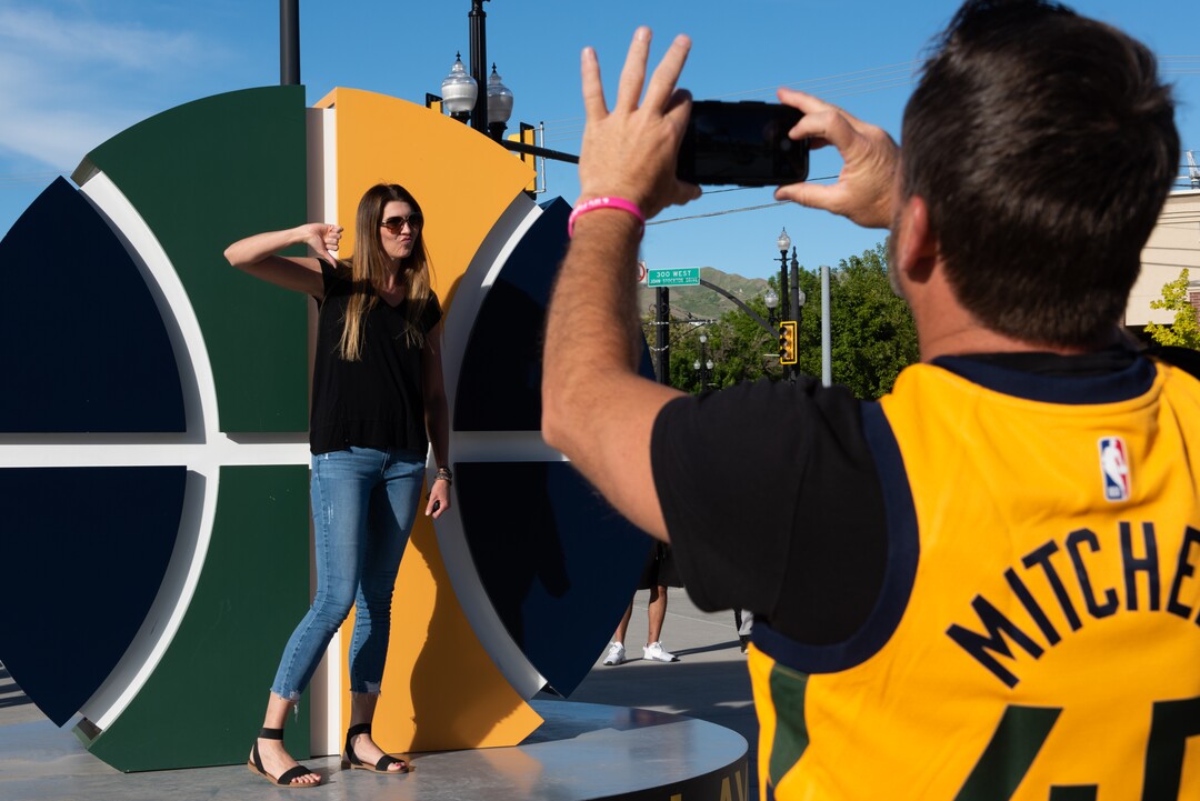 (Briana Scroggins | Special to The Tribune) Emily Lopez, a Suns fan, has her photo taken by her friend Dusty Jorgenson outside of Vivint Smart Home Arena before the Jazz play the Memphis Grizzlies in Salt Lake City on Wednesday, May 26, 2021.