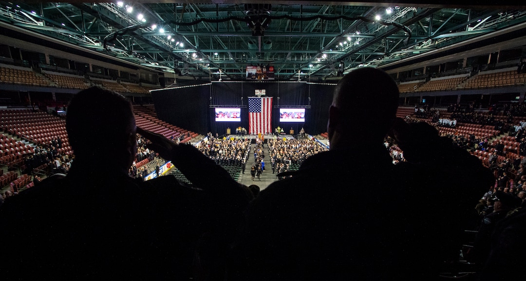 (Rick Egan  |  The Salt Lake Tribune)     Officers salute as the casket is carried into the Maverik Center, for the funeral for South Salt Lake police officer, David Romrell, who died after being struck by a car during a clash with two burglary suspects on Nov. 24. Wednesday, Dec. 5, 2018.