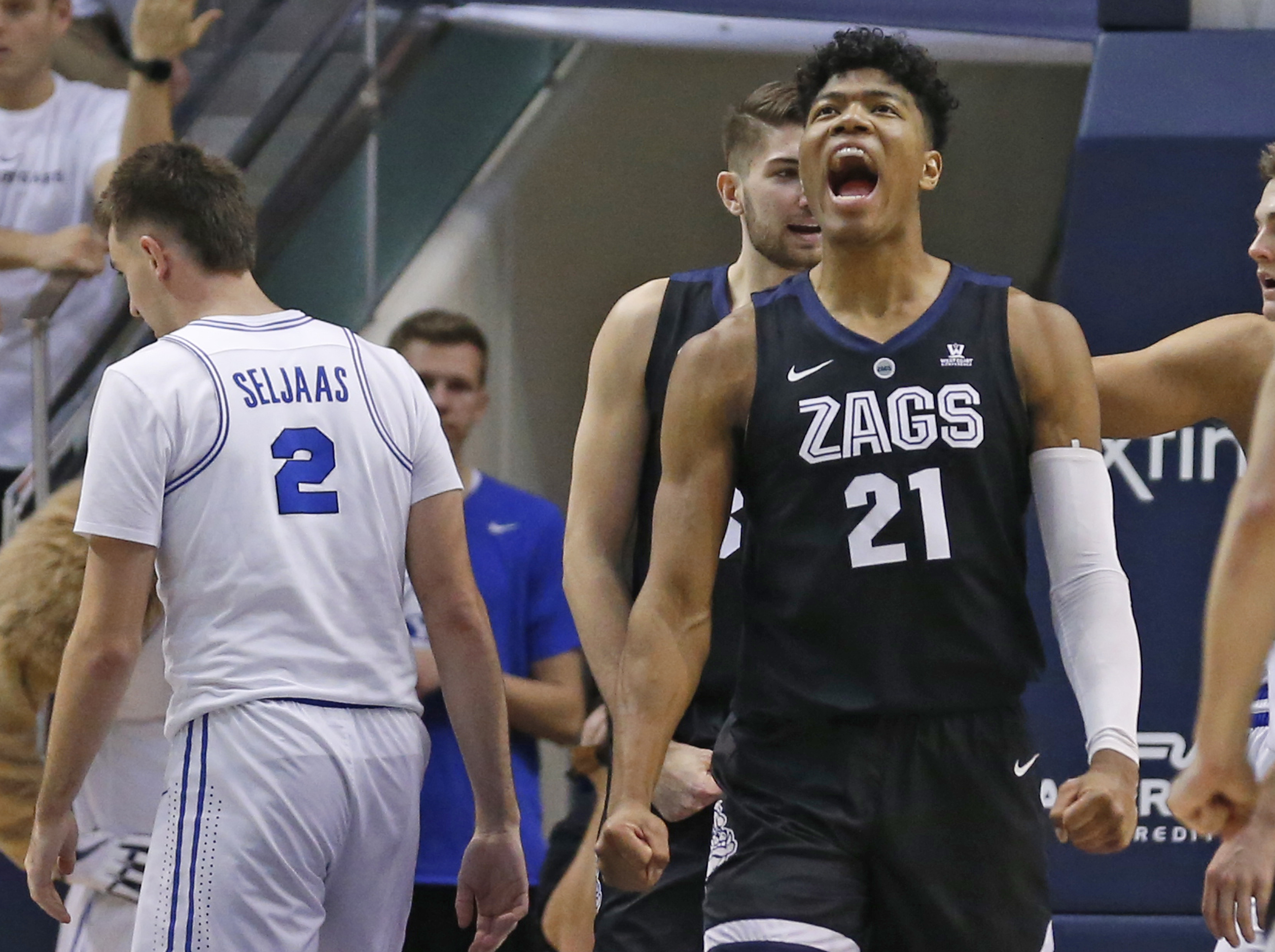 Gonzaga forward Rui Hachimura (21) reacts after scoring while BYU guard Zac Seljaas (2) walks away during the second half of an NCAA college basketball game Thursday, Jan. 31, 2019, in Provo, Utah. (AP Photo/Rick Bowmer)