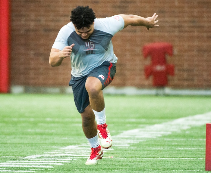(Rick Egan  |  The Salt Lake Tribune)      Filipo Mokofisi runs an agility drill, during University of Utah's 2018 Pro Day for NFL scouts, at Spence Eccles Field House, Wednesday, March 28, 2018.