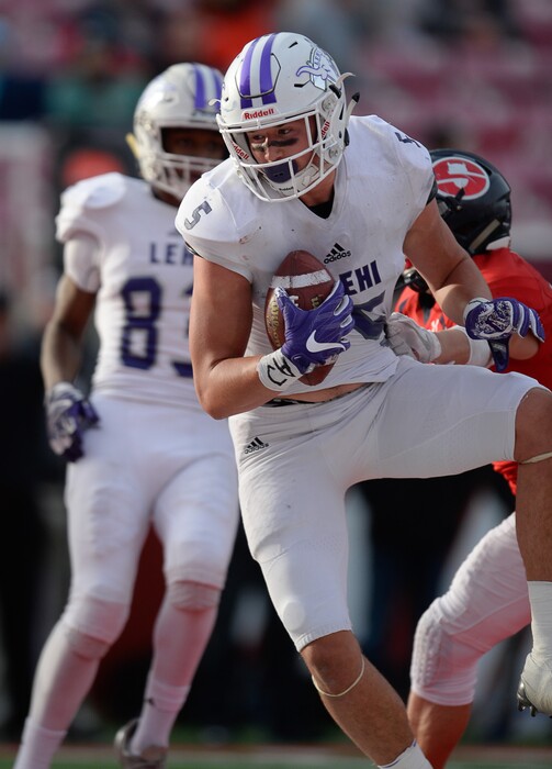 (Francisco Kjolseth  |  The Salt Lake Tribune)  Dallin Holker of Lehi pulls in a touchdown pass over Springville in the second quarter of their class 5A state semifinal game at Rice-Eccles Stadium, Thursday, Nov. 9, 2017.