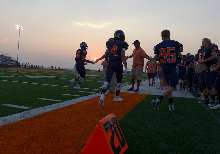 (Leah Hogsten  |  The Salt Lake Tribune)  Brighton High School leads Herriman High School 9-7 at the half during the 2015 season opener at Brighton High School, Friday, August 21, 2015. 