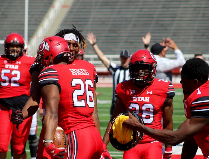 (Christopher Kamrani | The Salt Lake Tribune) Utah defensive back Terrell Burgess (26) celebrates his interception with teammates Siaosi Mariner, Javelin Guidry and Tyler Huntley in Saturday's Red-White game at Rice-Eccles Stadium.