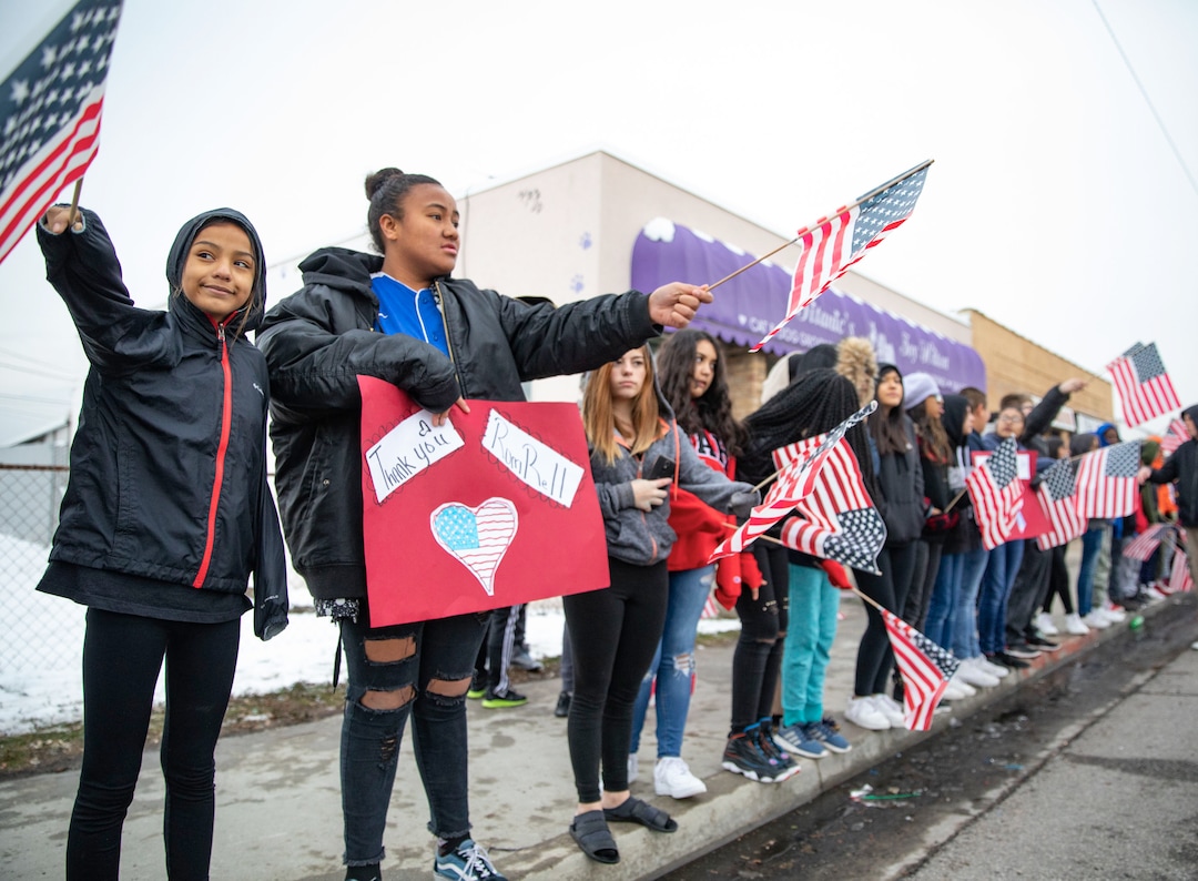 (Keith Johnson  |  special to The Salt Lake Tribune) Students and staff from Granite Park Jr. High line State Street near 3000 South to watch the funeral procession for Officer David Romrell Dec. 5, 2018 in South Salt Lake, Utah. Officer Romrell, a South Salt Lake police officer, was killed in the line of duty Nov. 24th when he was struck by a car driven by a fleeing suspect. 