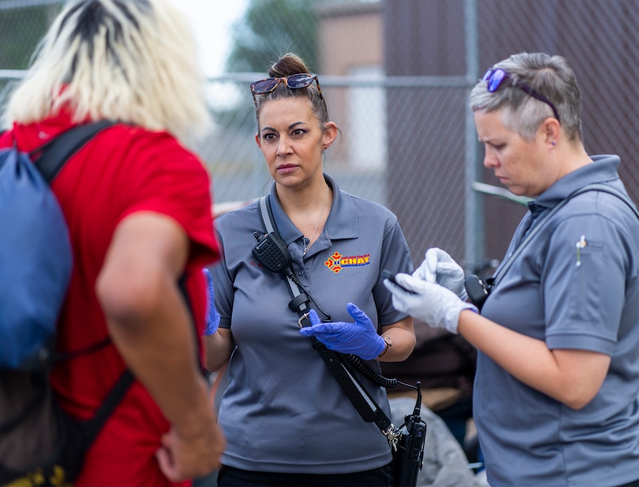 (Rick Egan | The Salt Lake Tribune) Salt Lake City Fire Department CHAT members Sarah Bohe and Shannon Luckart assist the unsheltered during an abatement on on Thursday, July 27, 2023. The Community Health Access Team works daily to help people experiencing various crises around the city.