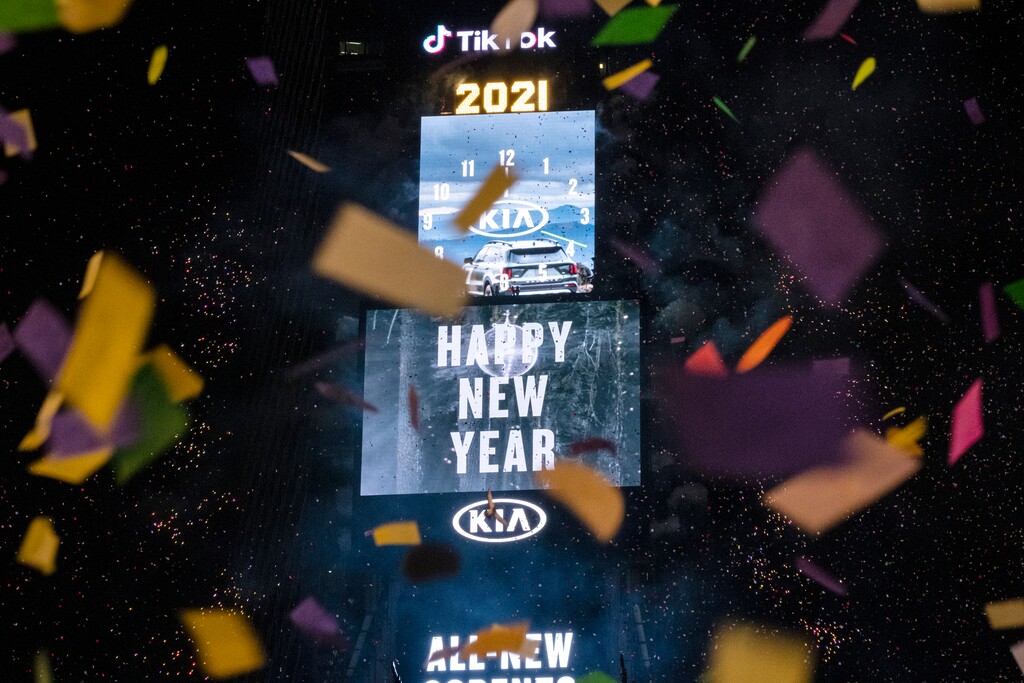 Confetti flies after the Times Square New Year's Eve Ball drops in a nearly empty Times Square, late Thursday, early Friday, Jan. 1, 2021, in New York, as the area normally packed with revelers remained closed off to due to the ongoing coronavirus pandemic. (AP Photo/Craig Ruttle)
