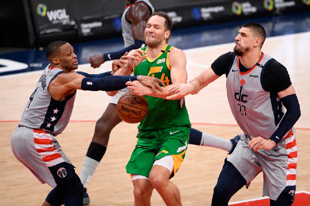 Utah Jazz forward Bojan Bogdanovic (44) loses the ball against Washington Wizards guard Russell Westbrook, left, and center Alex Len (27) during the first half of an NBA basketball game, Thursday, March 18, 2021, in Washington. (AP Photo/Nick Wass)