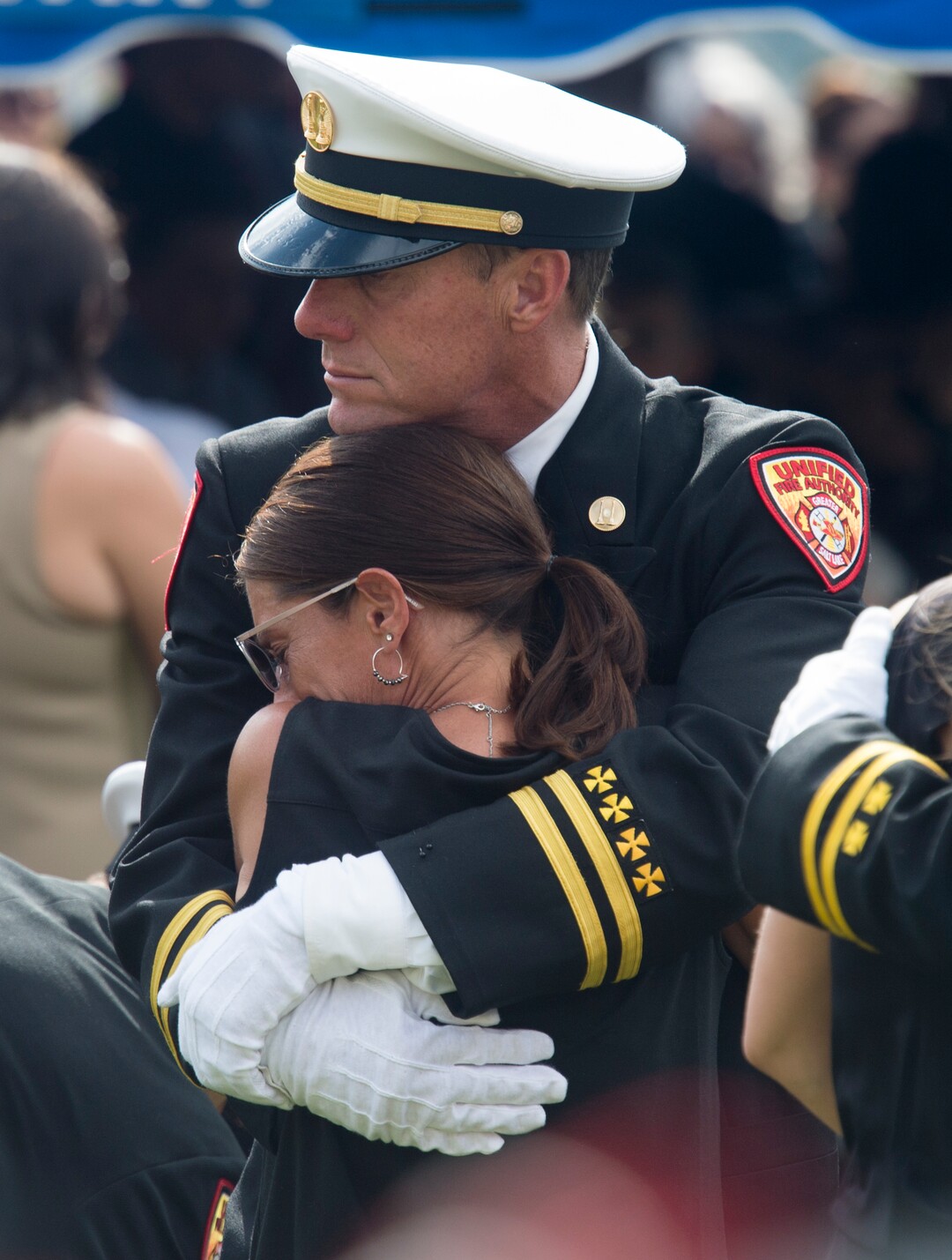 (Rick Egan  |  The Salt Lake Tribune)    A couple hug each other at the graveside service for Matthew Burchett at East Lawn Memorial Hills Cemetery in Provo, Monday, Aug. 20, 2018.
