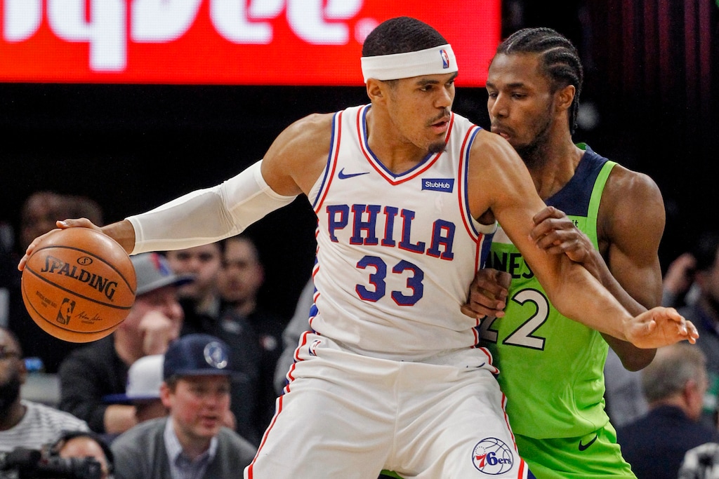 Philadelphia 76ers forward Tobias Harris (33) works for position against Minnesota Timberwolves forward Andrew Wiggins (22) in the first quarter of an NBA basketball game Saturday, March 30, 2019, in Minneapolis. (AP Photo/Bruce Kluckhohn)