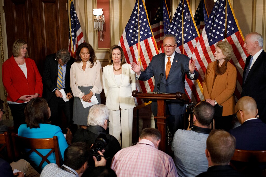 (Tom Brenner | The New York Times) Senate Minority Leader Chuck Schumer (D-N.Y.) with House Speaker Nancy Pelosi (D-Calif.) with other Congressional Democrats during a news conference on Capitol Hill, in Washington, on Monday, Sept. 9, 2019. The Democrats called for President Donald Trump to defy the National Rifle Association and get behind legislation, already passed by the House but blocked in the Senate, to expand background checks to nearly all gun buyers.