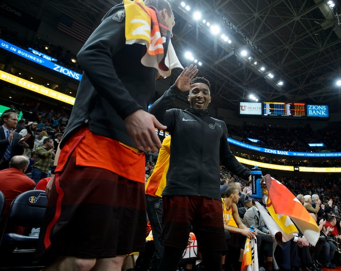 (Steve Griffin  |  The Salt Lake Tribune) Utah Jazz guard Donovan Mitchell (45) and Utah Jazz forward Joe Ingles (2) celebrate a victory over the NBA Champion Golden State Warrior at Vivint Smart Home Arena in Salt Lake City Tuesday January 30, 2018.