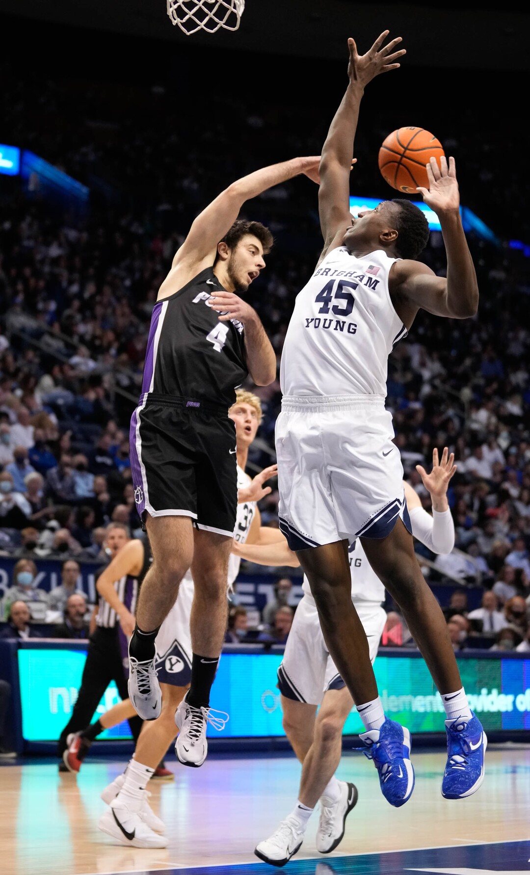 (Francisco Kjolseth | The Salt Lake Tribune) Portland Pilots guard Nikola Milosevic (4) is pressured by Brigham Young Cougars forward Fousseyni Traore (45) in WCC basketball action between the Brigham Young Cougars and the Portland Pilots, at the Marriott Center, on Saturday, January 22, 2022.