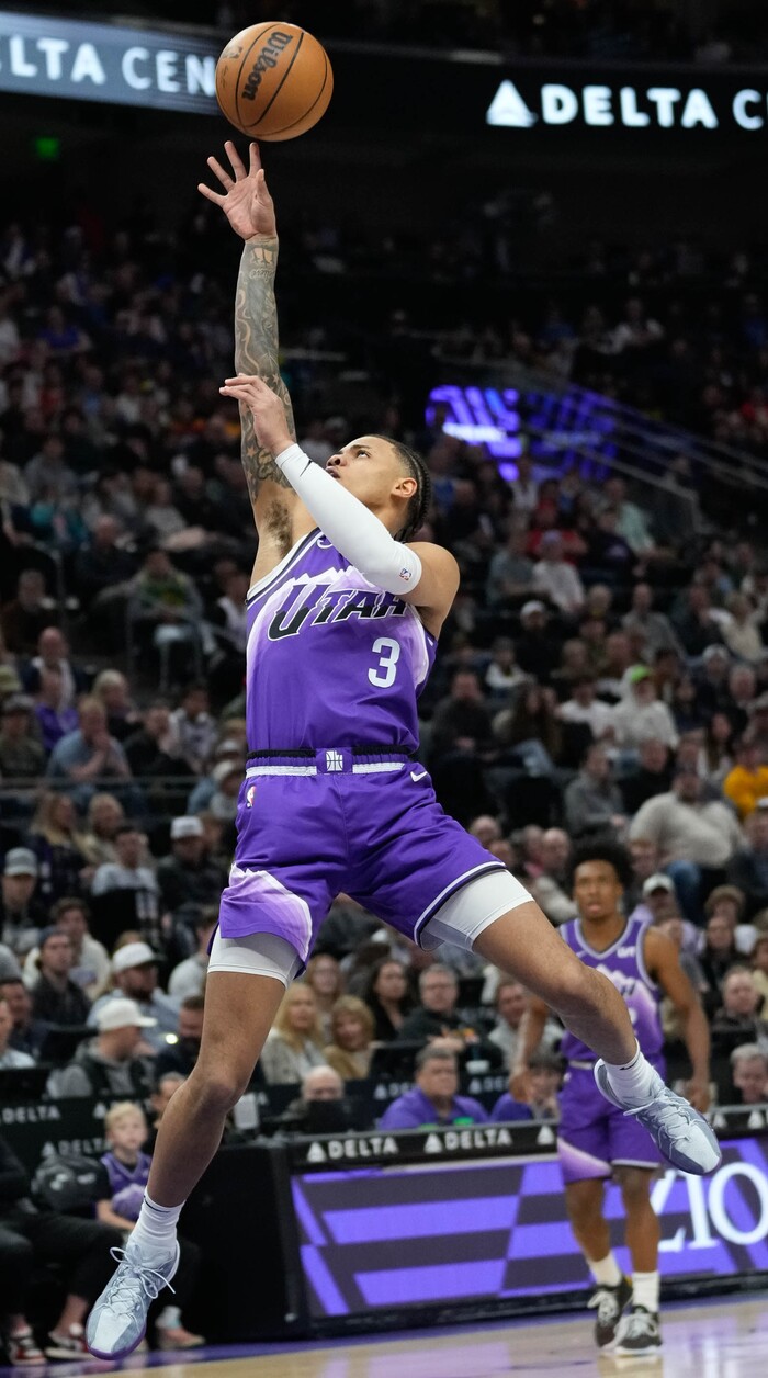 (Francisco Kjolseth  |  The Salt Lake Tribune) Utah Jazz guard Keyonte George (3) stretches out towards the basket against the Dallas Mavericks in NBA basketball Monday, March 25, 2024, in Salt Lake City.