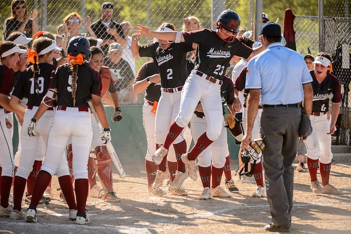(Trent Nelson | The Salt Lake Tribune)
Herriman vs. Syracuse in the 6A Softball State Championship game, Thursday May 24, 2018. Herriman's Libby Parkinson (23) leaps home after hitting a home run.