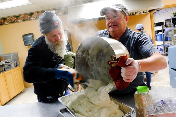 (Francisco Kjolseth | The Salt Lake Tribune) Jonathan Allen, left, and Mike Ready ready mashed potatoes at the Salt Lake City Mission at 1055 North Redwood Road in Salt Lake City, as they host a Thanksgiving banquet for the homeless and the hungry on Thursday, Nov. 28, 2019.